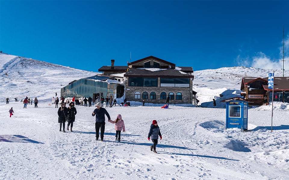 Families enjoying snow activities at Kaimaktsalan Ski Resort on Mount Voras, Northern Greece