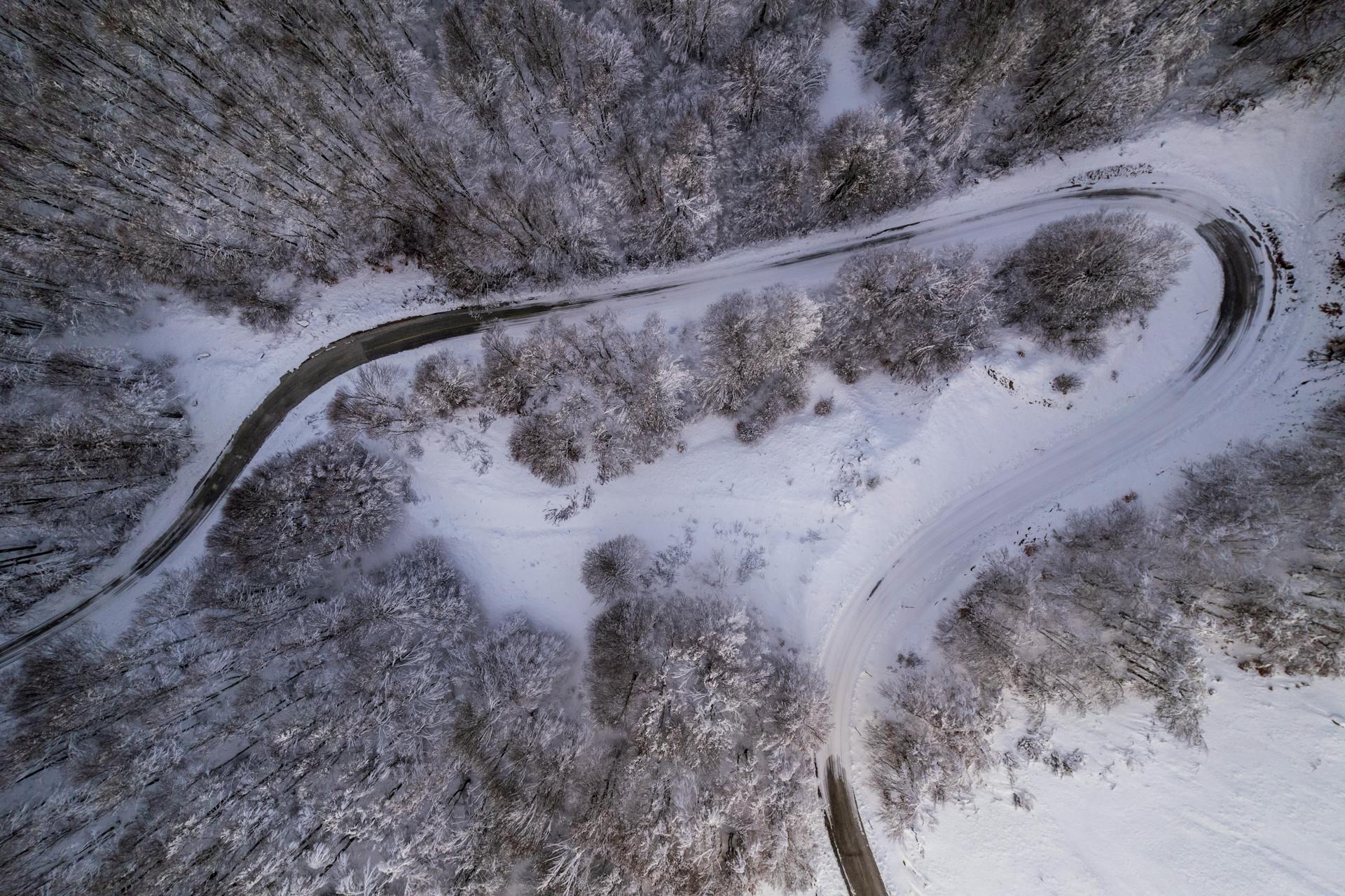 Snowy mountain road in Kastoria during winter in Greece travel